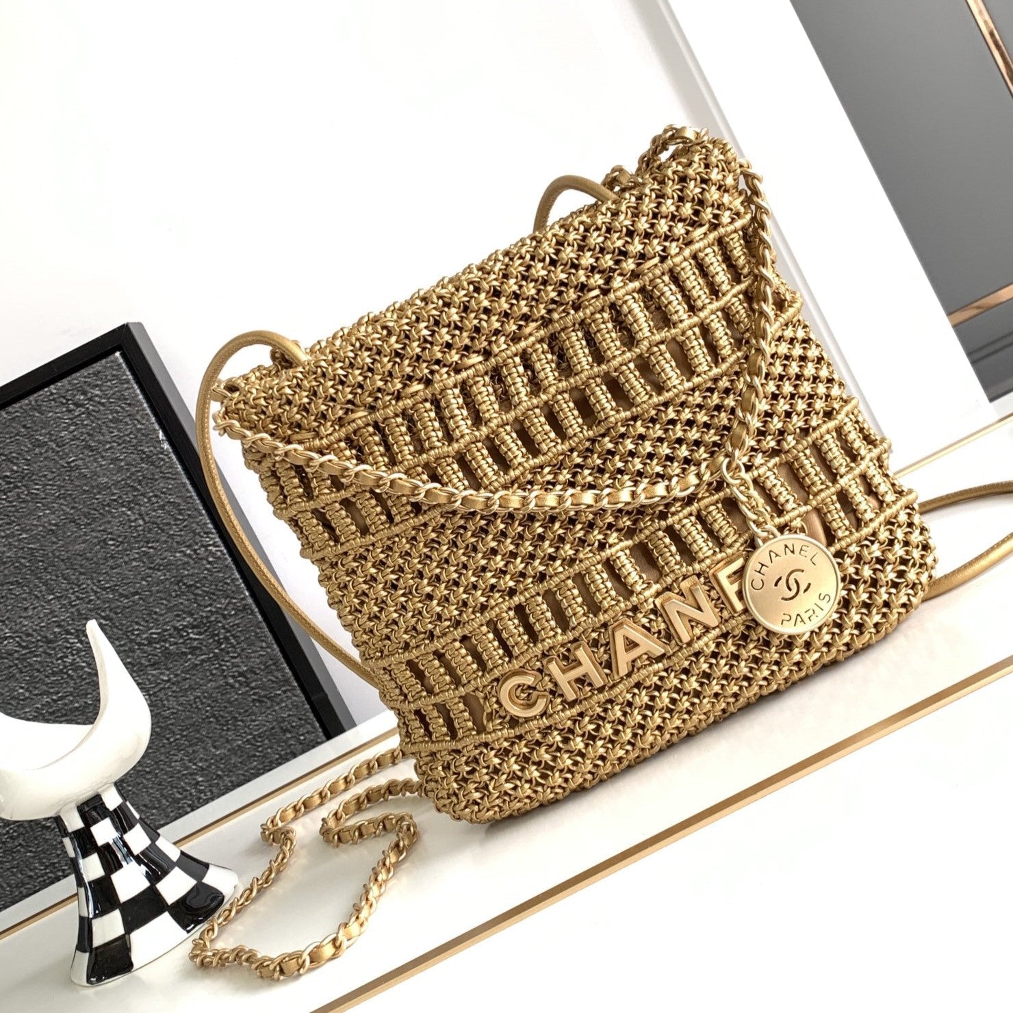CC Mini 22 bag gold woven cowhide front view luxury handbag