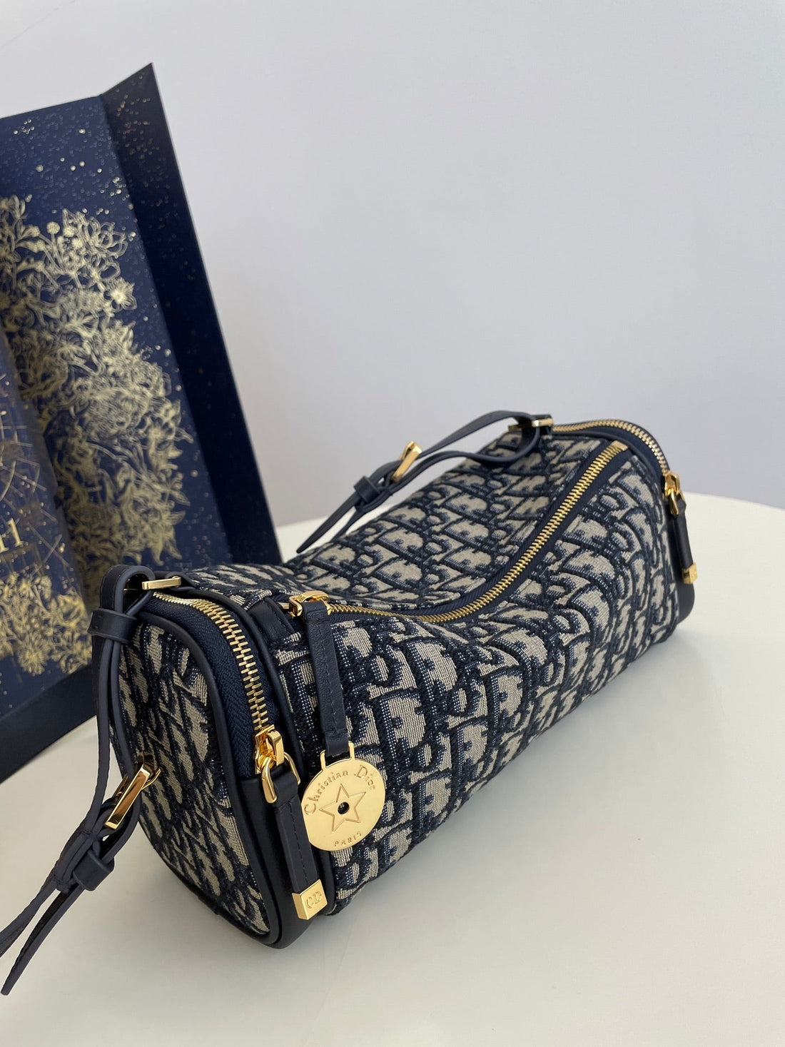 CD East-West cylindrical bag 27 blue jacquard canvas