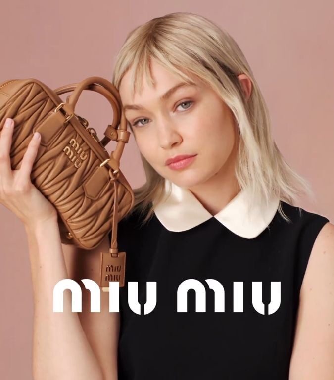 Miu Miu campaign with model and brown designer bag