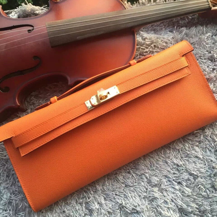 Luxury Hermes Orange Handcrafted Kelly Cut Clutch | Studio Nafay
