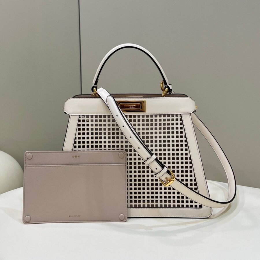 PEEKABOO ISEEU 34 IN WHITE PERFORATED CALFSKIN GOLD HARDWARE | Studio Nafay