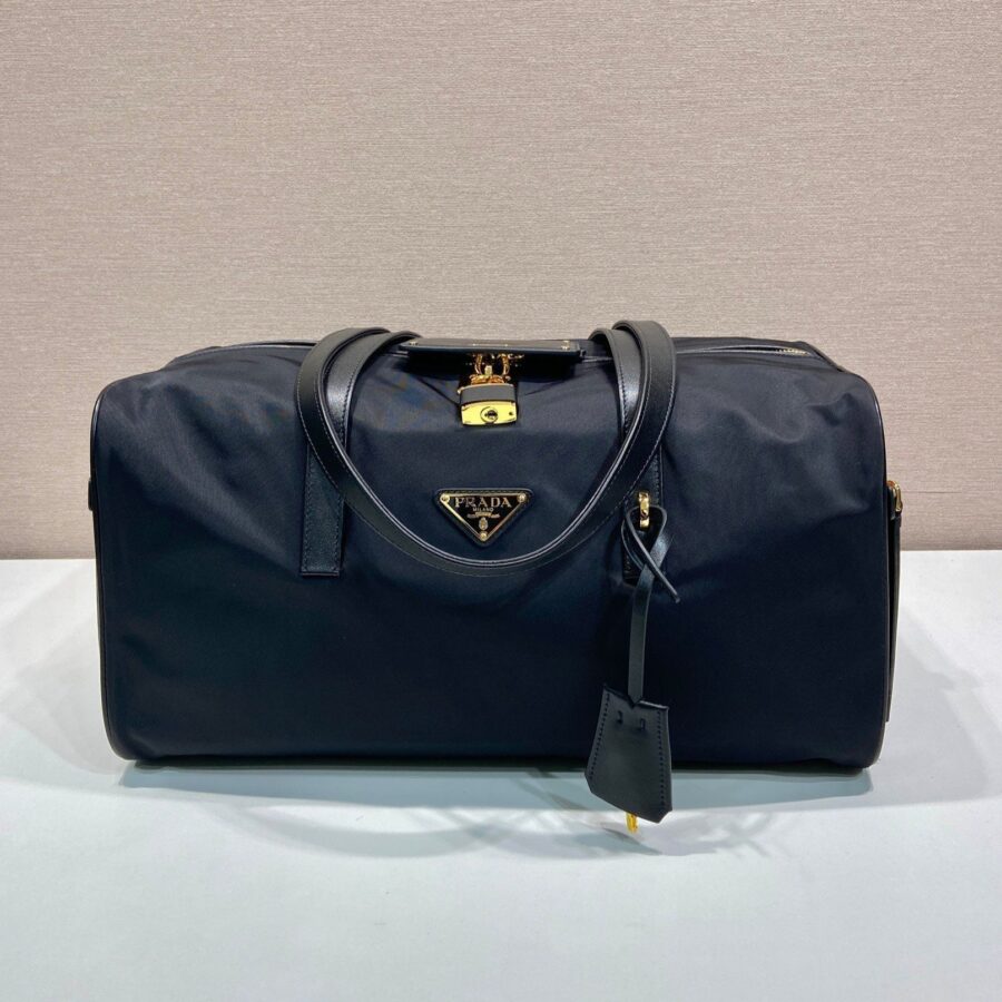 TRAVEL BAG 40 IN BLACK WATERPROOF FABRIC GOLD PADLOCK | Studio Nafay