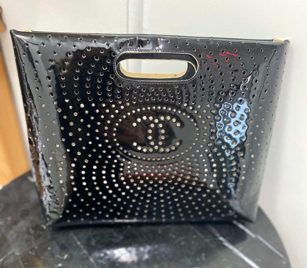 CHANEL CC PERFORATED PATENT CLUTCH BAG | Studio Nafay