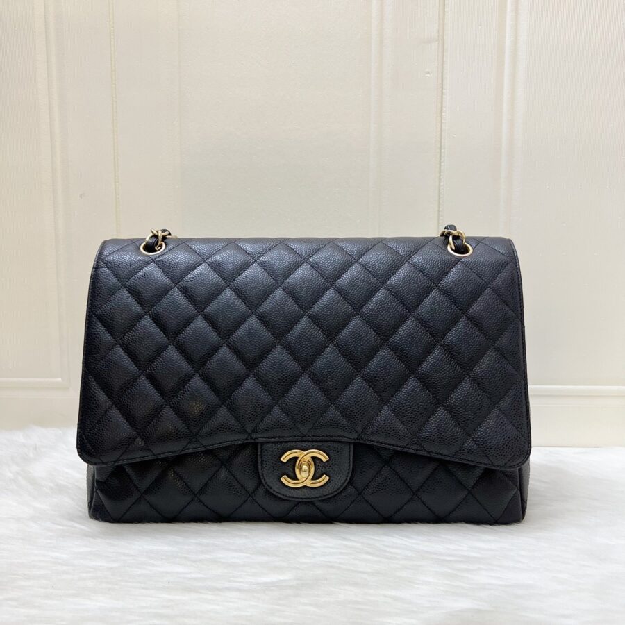 Chanel Maxi Classic Single Flap Bag in Black Caviar and GHW | Studio Nafay