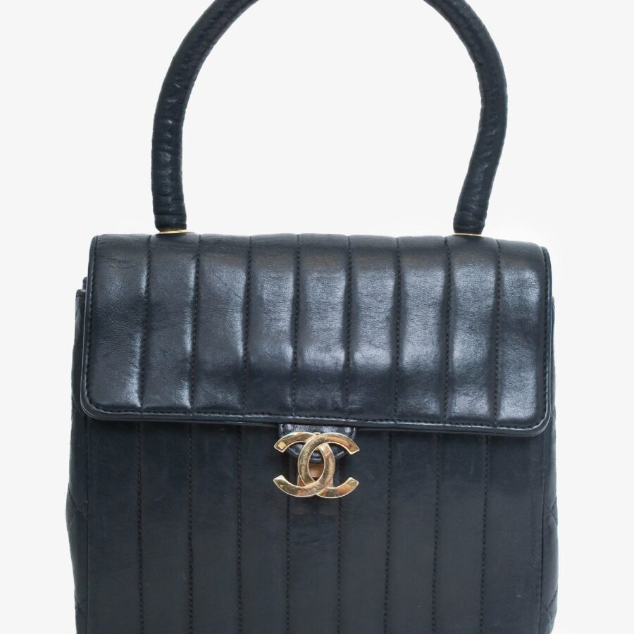 Chanel -94 Black Vertical Quilted Lambskin Top Handle Bag | Studio Nafay