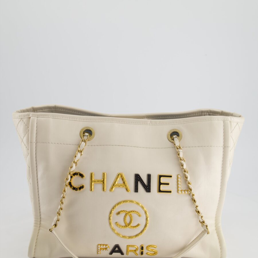 *HOT* Chanel White Small Deauville Tote Bag in Aged Calfskin Leather with Antique Gold Hardware and Pearl, Crystal Logo Detail | Studio Nafay
