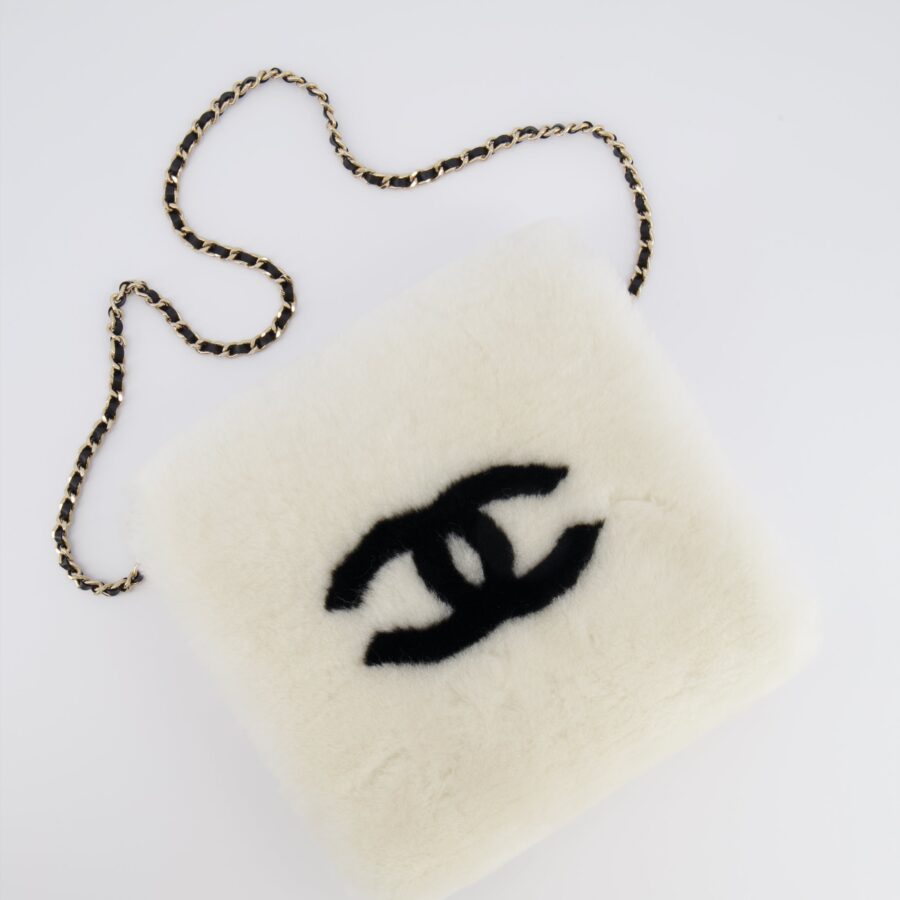 *HOT* Chanel Coco Neige 25/26 Ecru and Black Shearling Lambskin Muff Bag with Black CC Logo and Champagne Gold Chain Detail | Studio Nafay