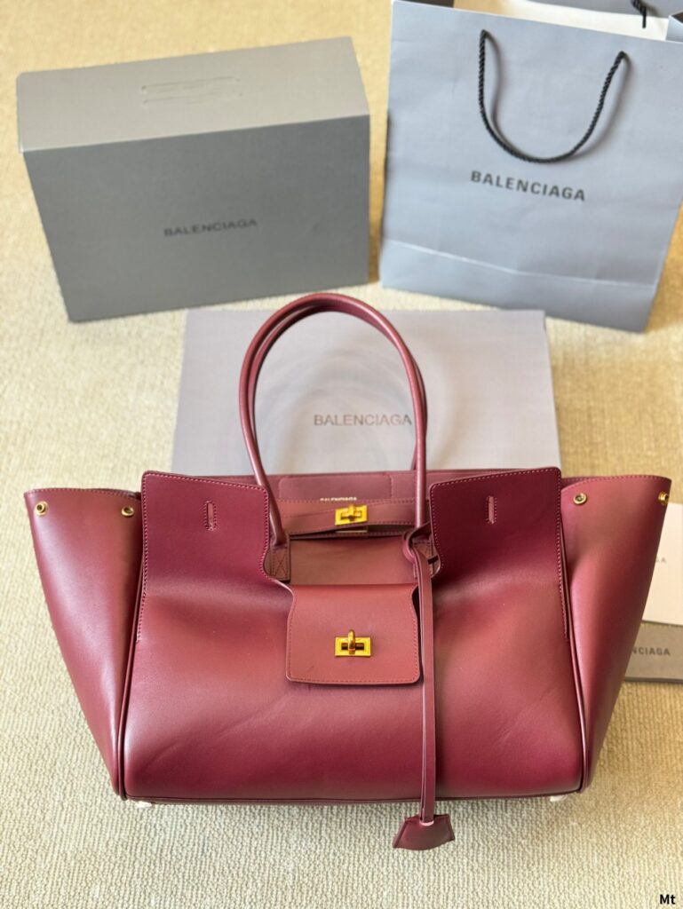BEL AIR CARRY ALL BAG 35 IN BURGUNDY RED NAPPA LAMBSKIN GOLD HARDWARE | Studio Nafay