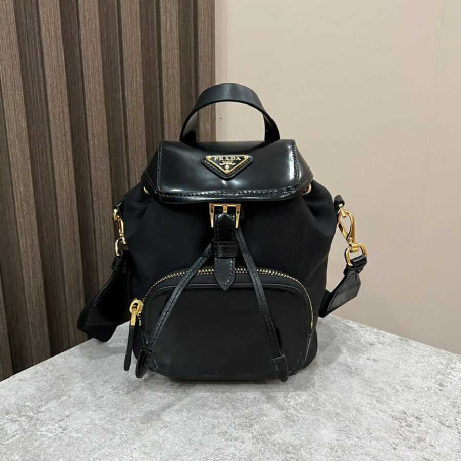 MINI BACKPACK 18 IN BLACK RE-NYLON AND GLOSSY CALFSKIN GOLD HARDWARE | Studio Nafay