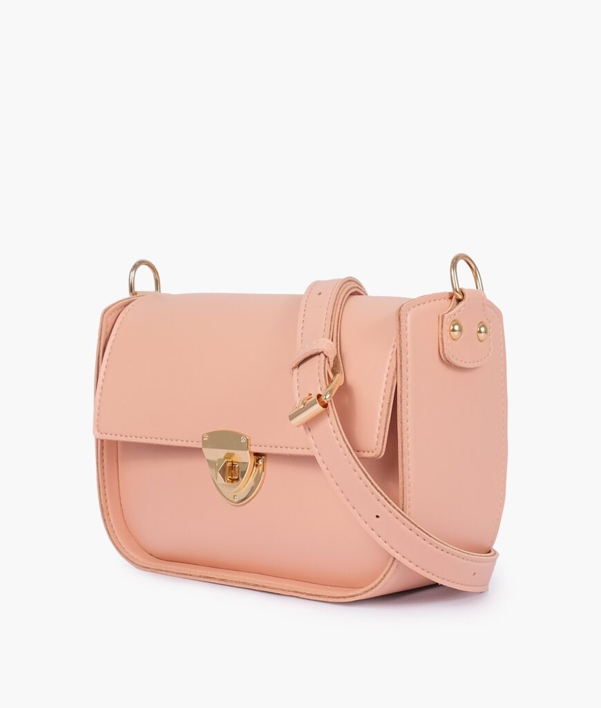 Peach saddle bag with twist lock | Studio Nafay