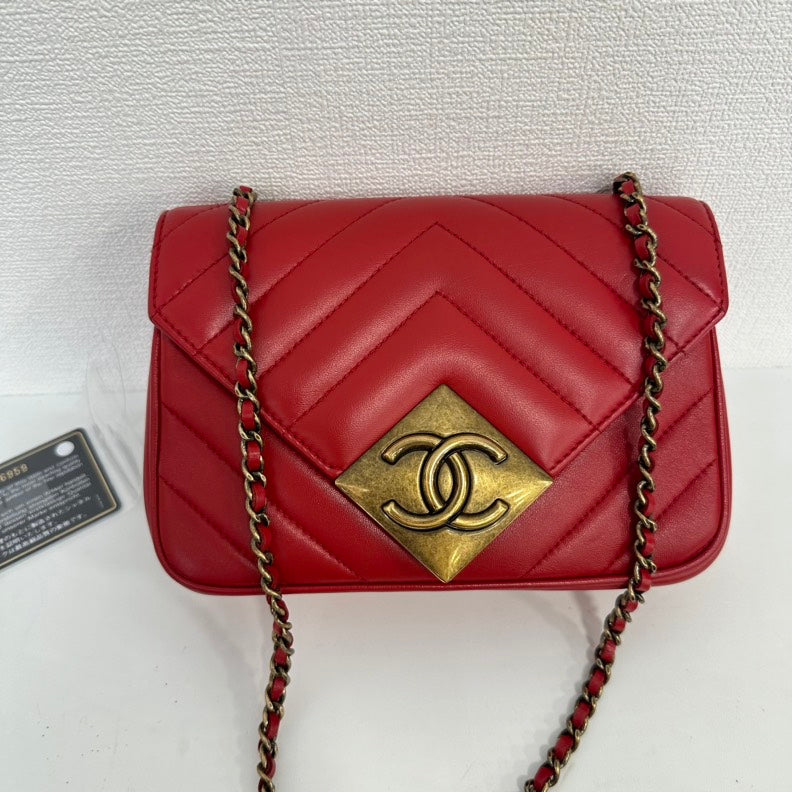 Chanel Red Lambskin Mini Single Flap Bag with Gold Chain and CC Logo | Studio Nafay