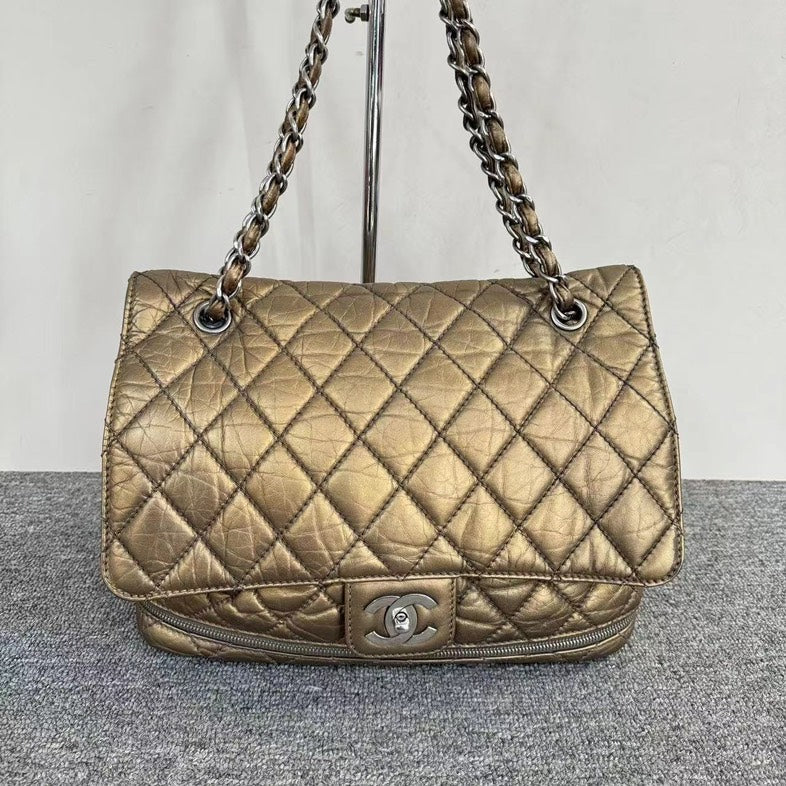Chanel Gold Quilted PNY Expandable Bag | Studio Nafay