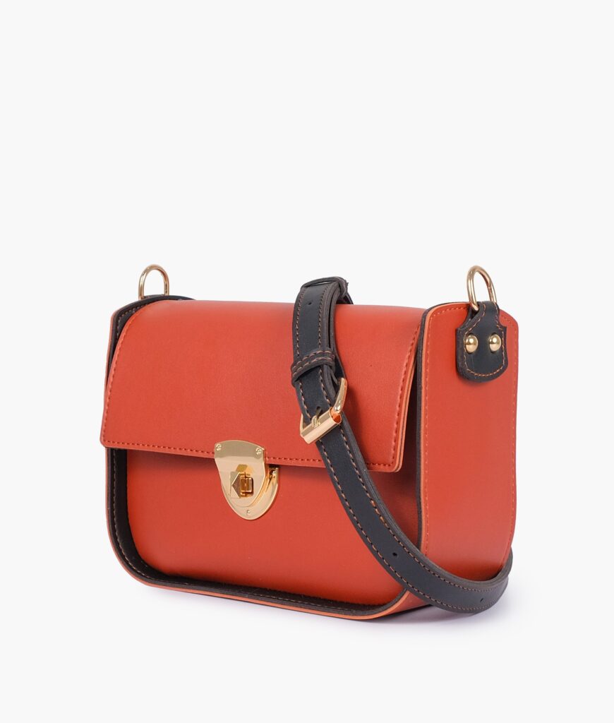 Rust saddle bag with twist lock | Studio Nafay