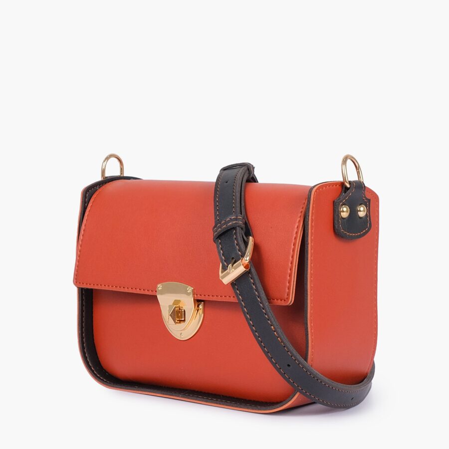 Rust saddle bag with twist lock | Studio Nafay